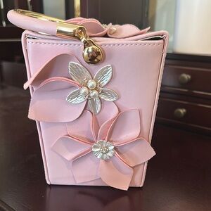 Chic Pink Floral Handbag with Gold Accents